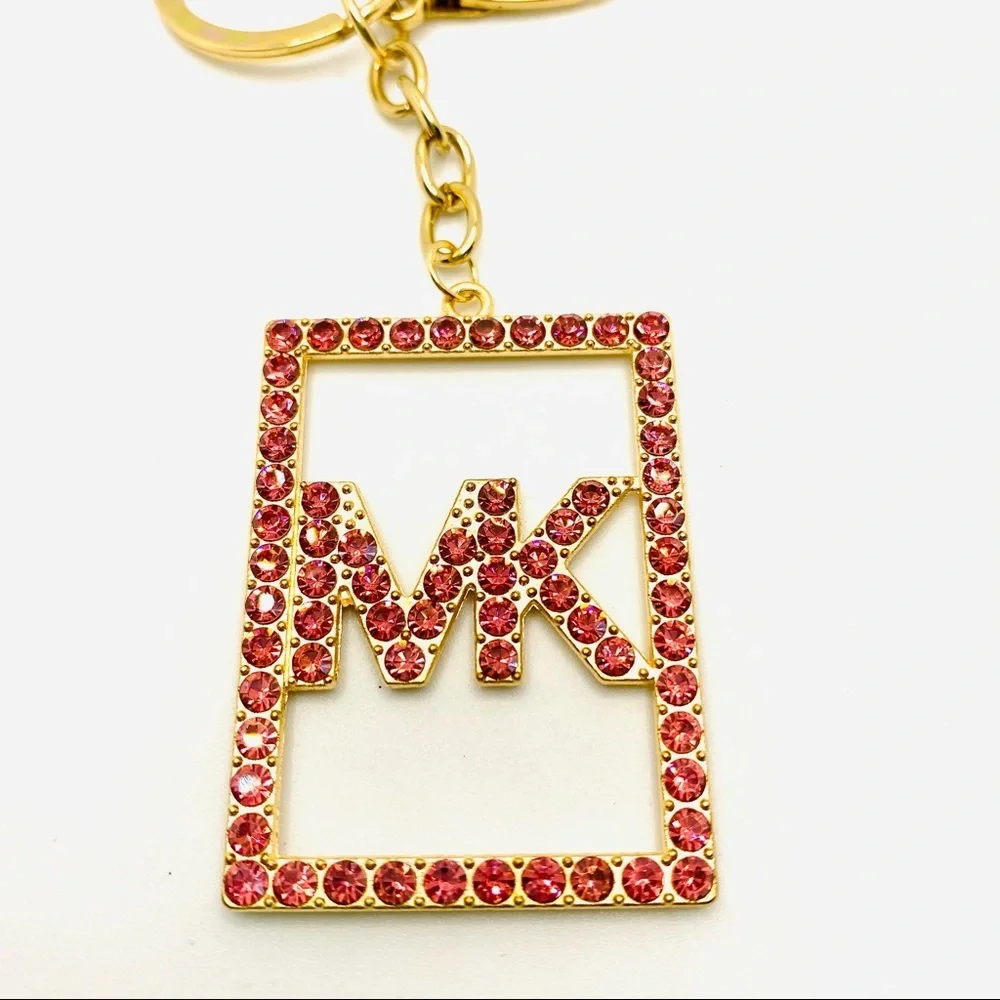 Purse Charm Key Chain MK Pink Crystals set in golden tone. BRAND NEW